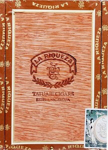 Buy Tatuaje La Riqueza No.1 Online: Using a old Cuban cigar brand, Tatuaje has created a cigar that is rich in flavor. The cigar features a Connecticut Broadleaf producing notes of spice, cocoa and cedar. 