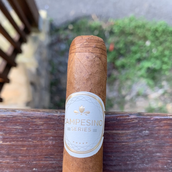 Lighting an uncut cigar